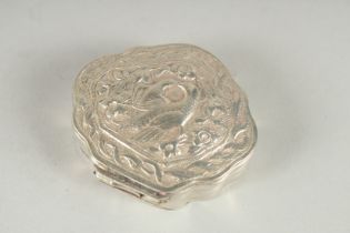 A SMALL WHITE METAL BOX, the hinged cover embossed with a pair of love birds. 2.25ins wide.