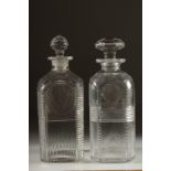TWO GEORGIAN SQUARE DECANTERS AND STOPPERS. 9ins high.