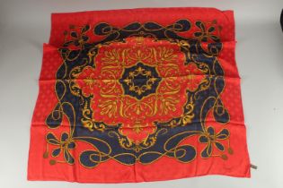 AN ASPREY RED AND BLUE SILK SCARF. 33ins x 33ins in an Asprey box.