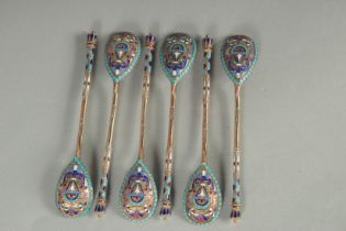 A SET OF SIX RUSSIAN SILVER AND ENAMEL SPOONS. 12cm long. Marks: 84, head. Weight: 75gms.