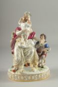 A VERY GOOD AND FINE 19TH CENTURY MEISSEN GROUP, a lady seated in a chair, a child on her lap, a