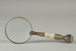 A MAGNIFYING GLASS with mother of pearl handle.