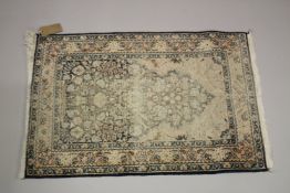 A SMALL PERSIAN PART SILK PRAYER RUG (WORN). 3ft 1ins x 2ft .