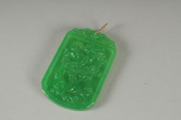 A CHINESE CARVED JADE GOLD TOP PENDANT. 5cm x 3cm.