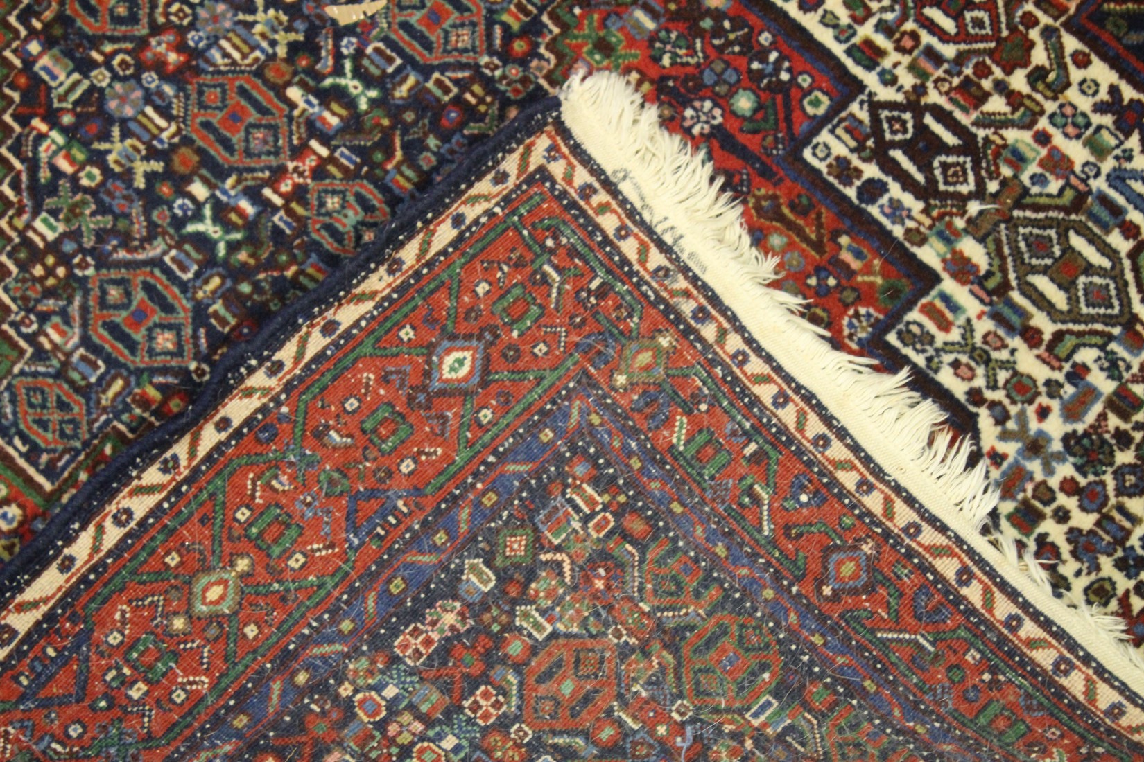 A PERSIAN WOOL CARPET cream, red and blue ground with all over stylised decoration. 4ft 9ins x 4ft - Image 3 of 3