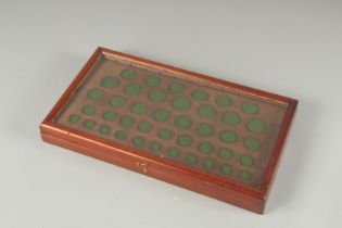 A COIN COLLECTING CABINET with glass top. 15ins x 8ins.