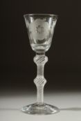A SUPERB JACOBITE WINE GLASS the bowl engraved with roses, wtih air twist and knop stem. 6.5ins