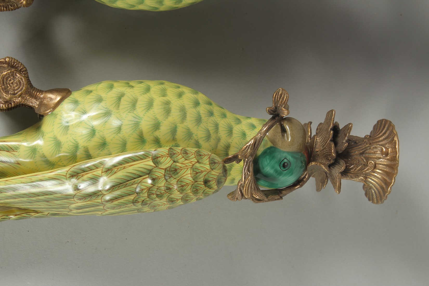 A GOOD PAIR OF PORCELAIN GREEN PARROT WALL SCONCES with gilt metal surrounds. 18.5ins long. - Image 3 of 4