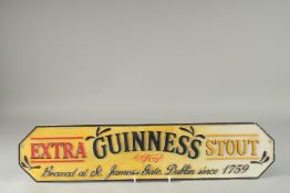 A CAST IRON GUINNESS SIGN. 22ins long.