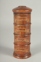 A FOUR TIER SPICE TOWER: cloves, ginger, mace, nutmeg. 7.5ins high.