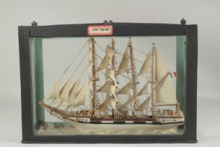 A GLASS CASED SAILING VESSEL "BRETANGE". 17ins long.