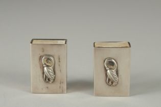TWO SILVER MATCH BOX HOLDERS.