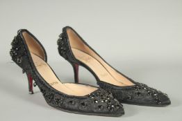 A PAIR OF CHRISTIAN LEBOUTIN BLACK BEADED SHOES. Size UK 37.