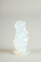 A SMALL SABINE IRRIDESSENCE GLASS CUPID with paper label. 1.75ins high
