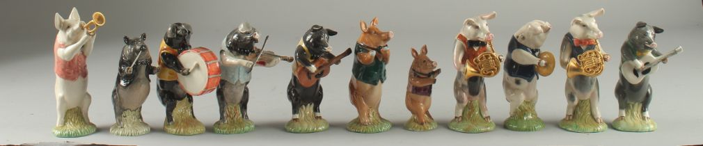 A COLLECTION OF ELEVEN BESWICK POTTERY PIGS (11)