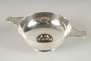 A GOOD ART DECO CIRCULAR QUAICH set with a brilliant cut stone. 4ins diameter.