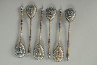 A SET OF SIX RUSSIAN SILVER AND ENAMEL SPOONS. 10cm long. Mark: Head. Weight: 40gms.