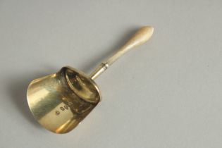 A GEORGE IV SILVER GILT SHOVEL SHAPED CADDY SPOON. Birmingham 1825, maker: Samuel Pemberton.