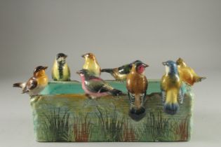 JEROME MASSIER A GOOD PORCELAIN RECTANGULAR JARDINIERE the sides with eight coloured birds. Signed