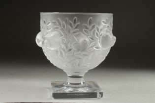 A LALIQUE FROSTED GLASS BOWL surrounded by chubby birds, on a plain square base. Signed Lalique,