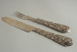 A VICTORIAN CAST SILVER CHRISTENING KNIFE AND FORK. Birmingham 1871.