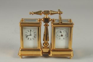 A GILT DOUBLE MINI CARRIAGE CLOCK with carrying handle. 4ins high.