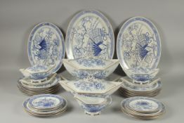 A CHRISTOPHER DRESSER DESIGN BLUE AND WHITE PART DINNER SET COMPRISING: Three oval dishes, 18ins,