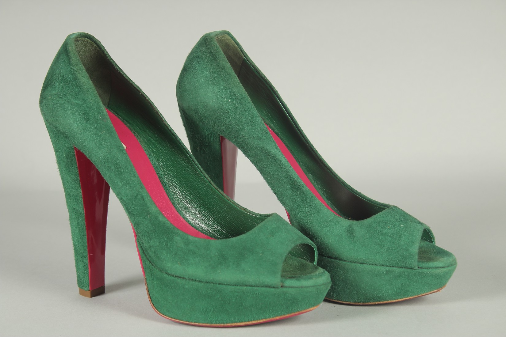 A PAIR OF MIU MIU GREEN SUEDE SHOES. Size UK 37, boxed.