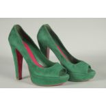 A PAIR OF MIU MIU GREEN SUEDE SHOES. Size UK 37, boxed.