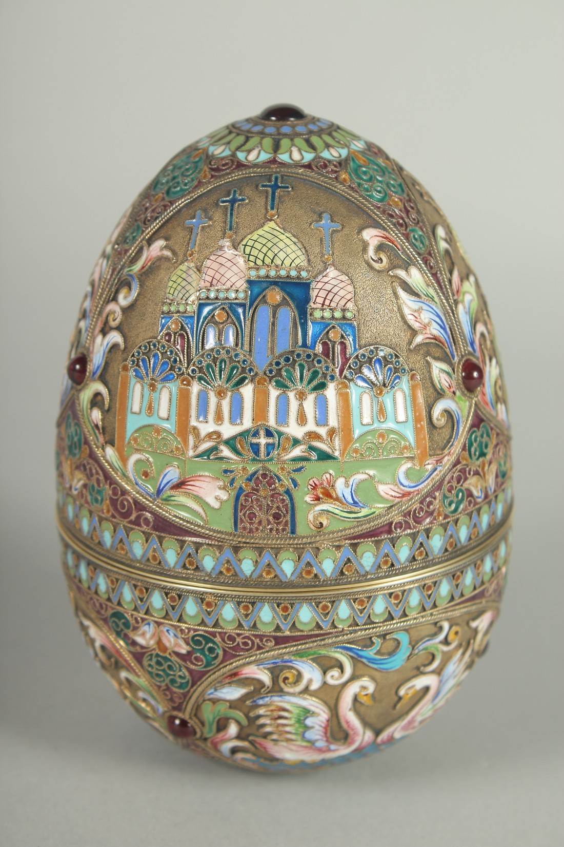 A LARGE RUSSIAN SILVER AND ENAMEL EGG, decorated with panels of white swans and Russian orthodox - Image 2 of 10