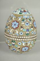 A RUSSIAN SILVER AND ENAMEL EGG 7cm high, 5cm diameter. Mark: 84. Weight: 65gms.