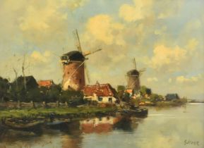 Jan Stork (19th/20th Century) Dutch, windmills on a Dutch waterway with barges in the foreground,