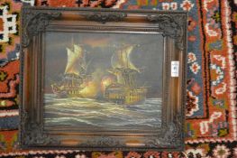 Galleons at sea, oil on board in a decorative frame.