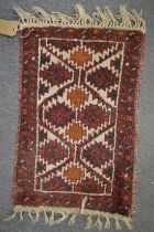 A small Persian mat 60cm x 40cm.