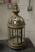 An ornate metal candle lantern.