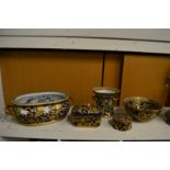 Gilt decorated pottery items to include an oval jardiniere, circular bowl, box and cover etc.