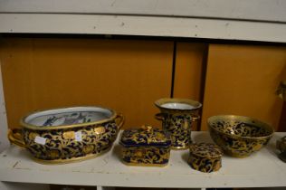 Gilt decorated pottery items to include an oval jardiniere, circular bowl, box and cover etc.