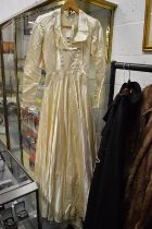 An early satin wedding dress.