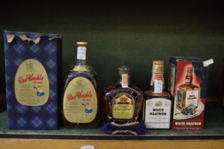 A small bottle of Seagrams Crown Royal Whisky, a bottle Red Hackle Whisky, boxed and a small