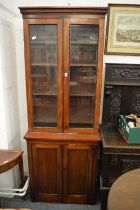 A 19th century mahogany narrow four door cupboard bookcase.