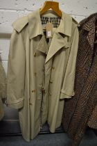 A Ladies Aquascutum full length rain coat.