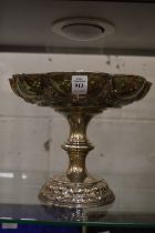 A good embossed silver pedestal tazza with engraved armorial.