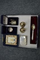 A group of silver items to include cigarette case, a pair of dwarf candlesticks etc.