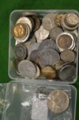 A box of various coins to include an early coin.