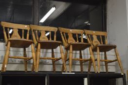 A set of five and one similar beech kitchen chairs.