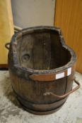 A barrel shaped log bin.