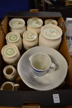 A collection of Kleen kitchen storage jars and other items.