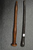 Two African or Polynesian hand clubs.