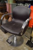 A hairdressers or barbers chair.