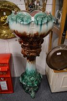 A good large majolica glazed pottery jardiniere and matching stand.